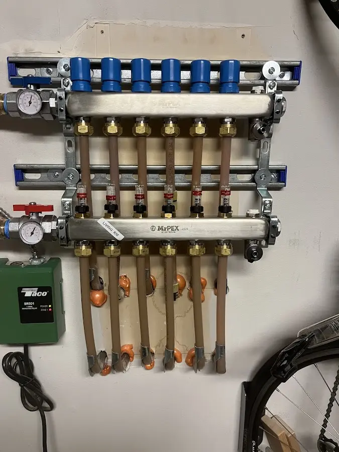 Plumber performing Water Heater Repair at a residential property in Sussex